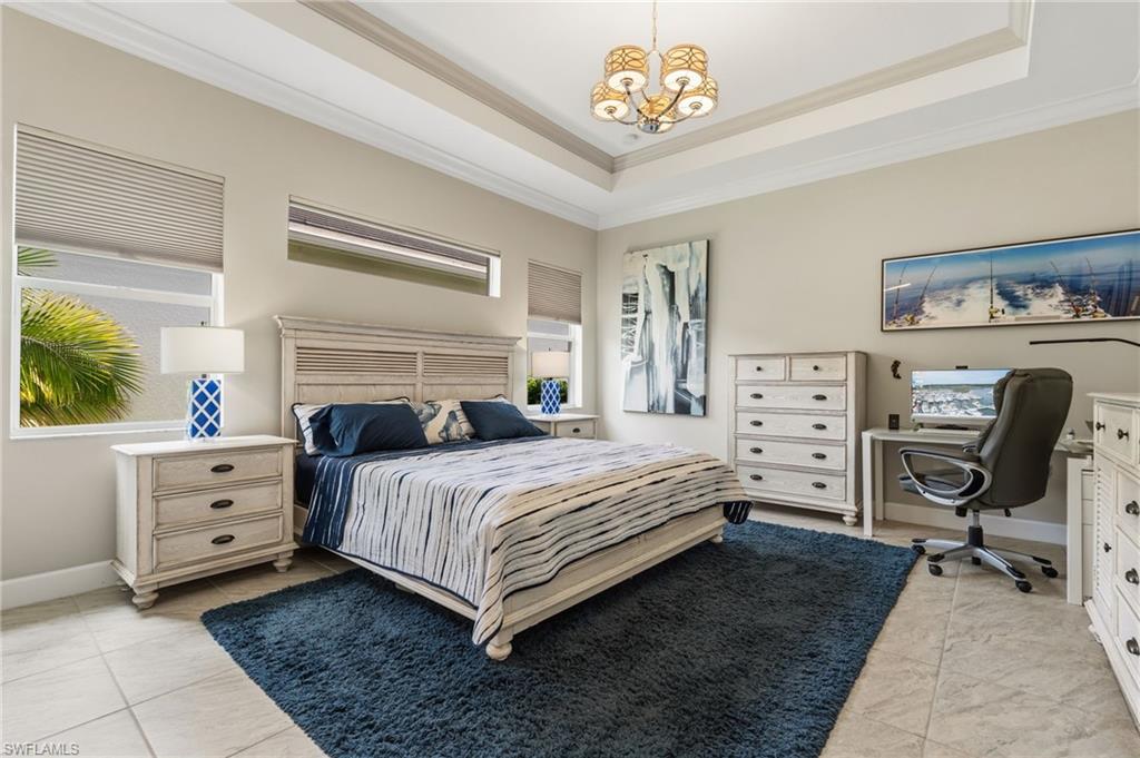 Primary bedroom features transom window for extra light