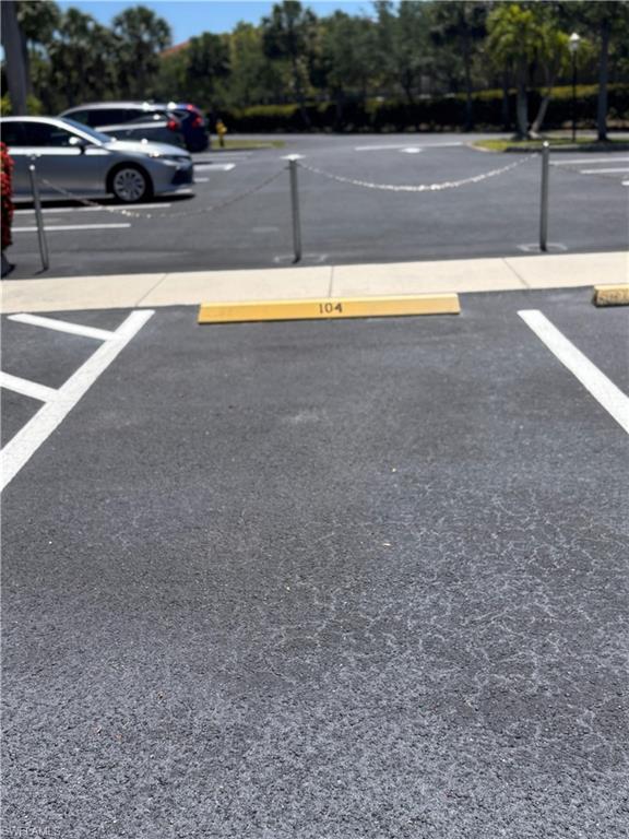 Paved parking space featuring a numbered parking block and white line markings