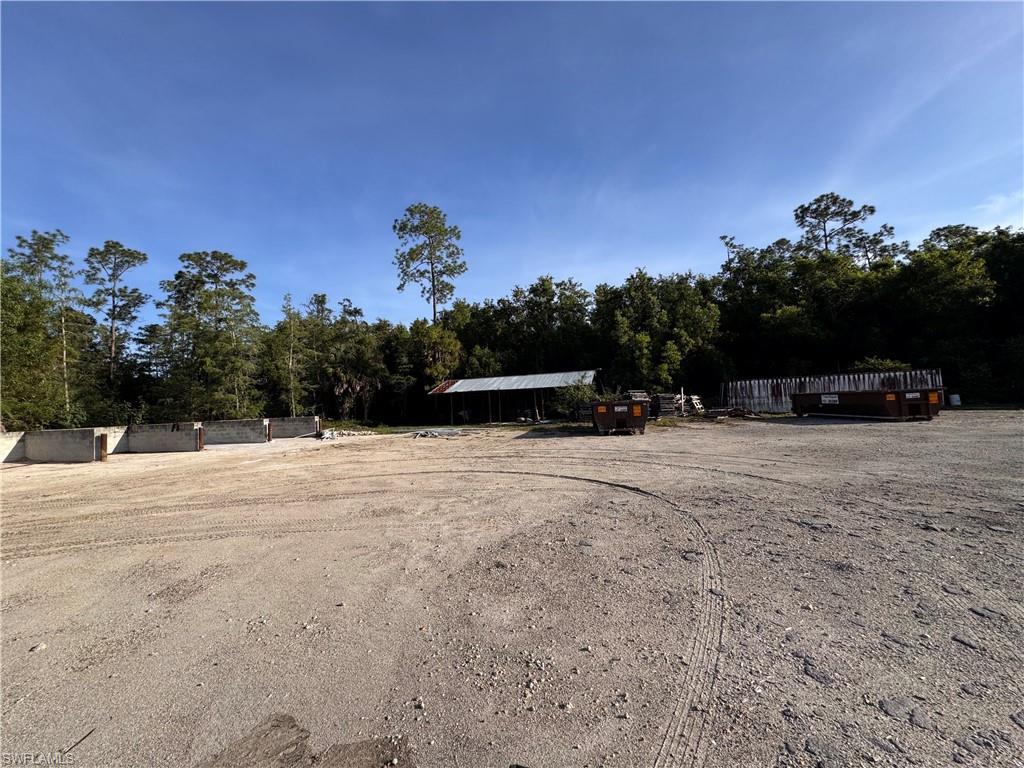 Expansive open lot with a large unpaved surface