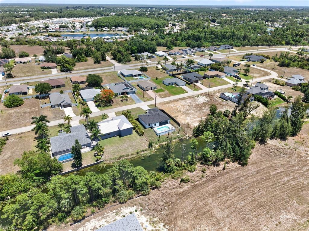 Aerial perspective showcasing a residential area with various single-story homes