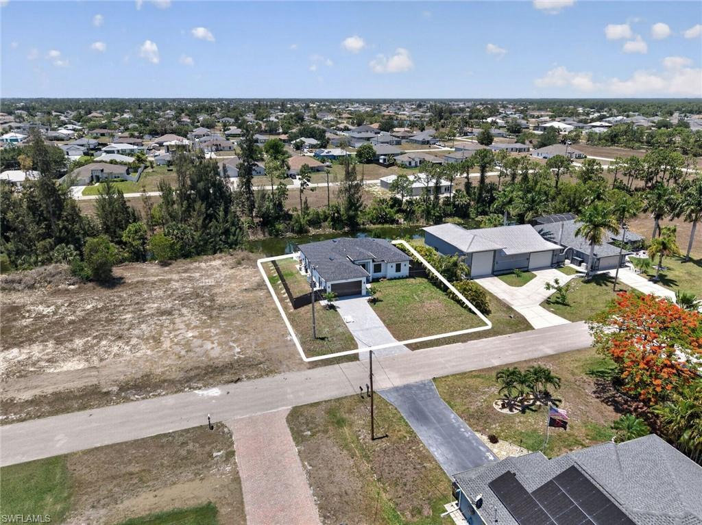 Single-story residence featuring a gray shingle roof and a two-car garage