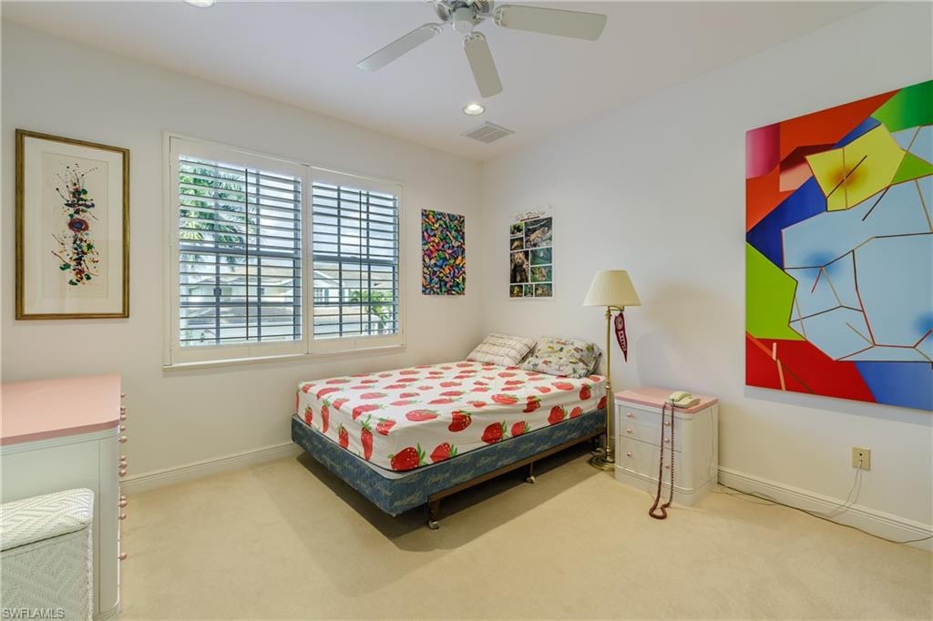 Bedroom featuring carpet floors and ceiling fan