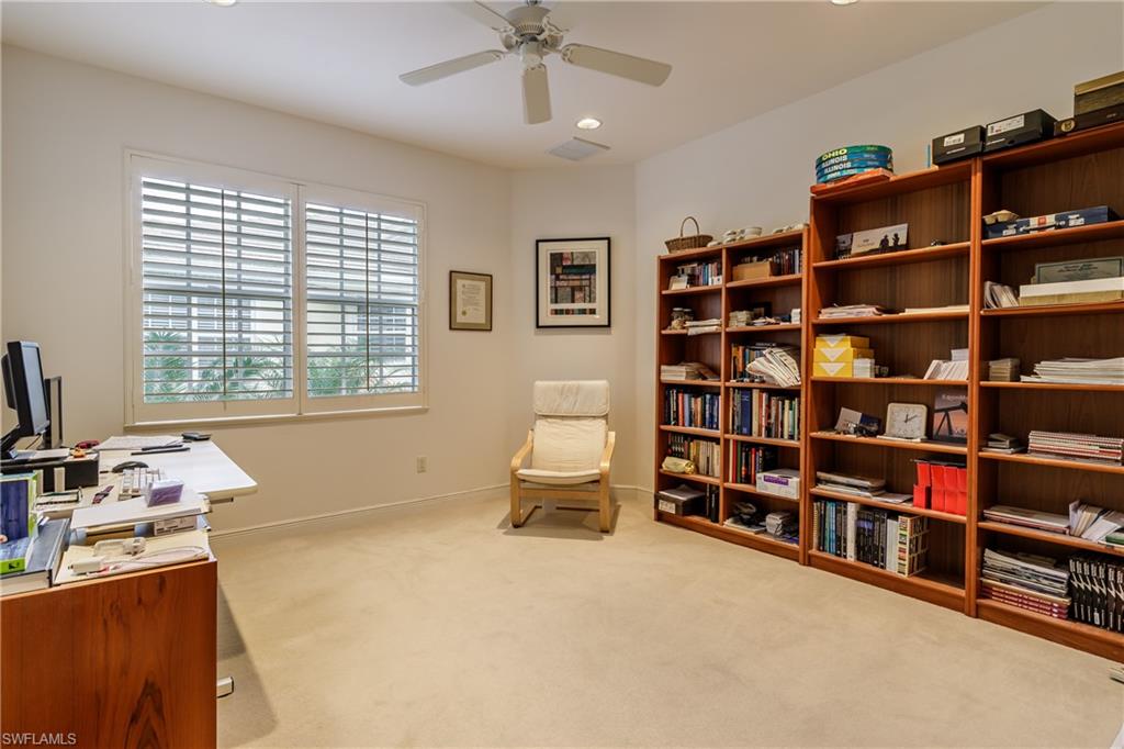 Carpeted office featuring baseboards, visible vents, a ceiling fan, and recessed lighting