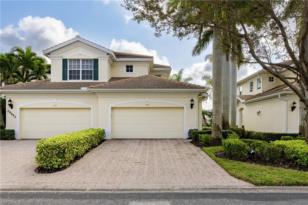 View of property with a garage