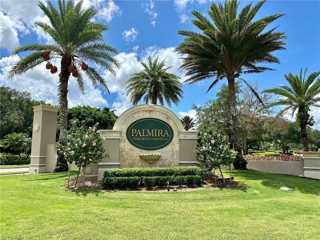 Community / neighborhood sign with a lawn