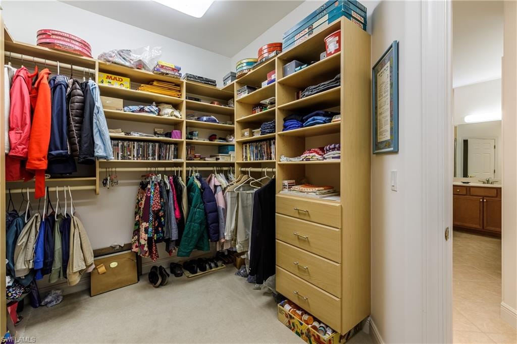 Walk in closet featuring light tile patterned floors