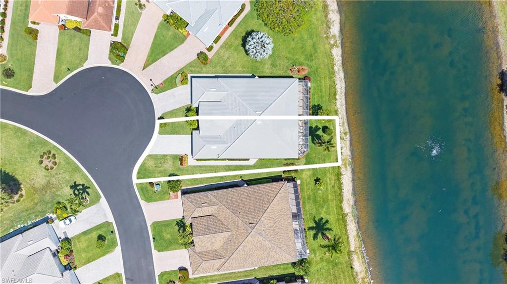 Aerial perspective highlighting a property with a water feature frontage and cul-de-sac access