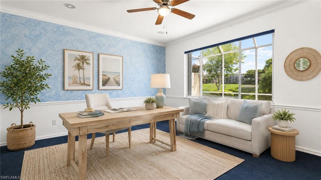 Spacious interior room featuring a large screened window, deep blue carpeting, and a ceiling fan with integrated lighting