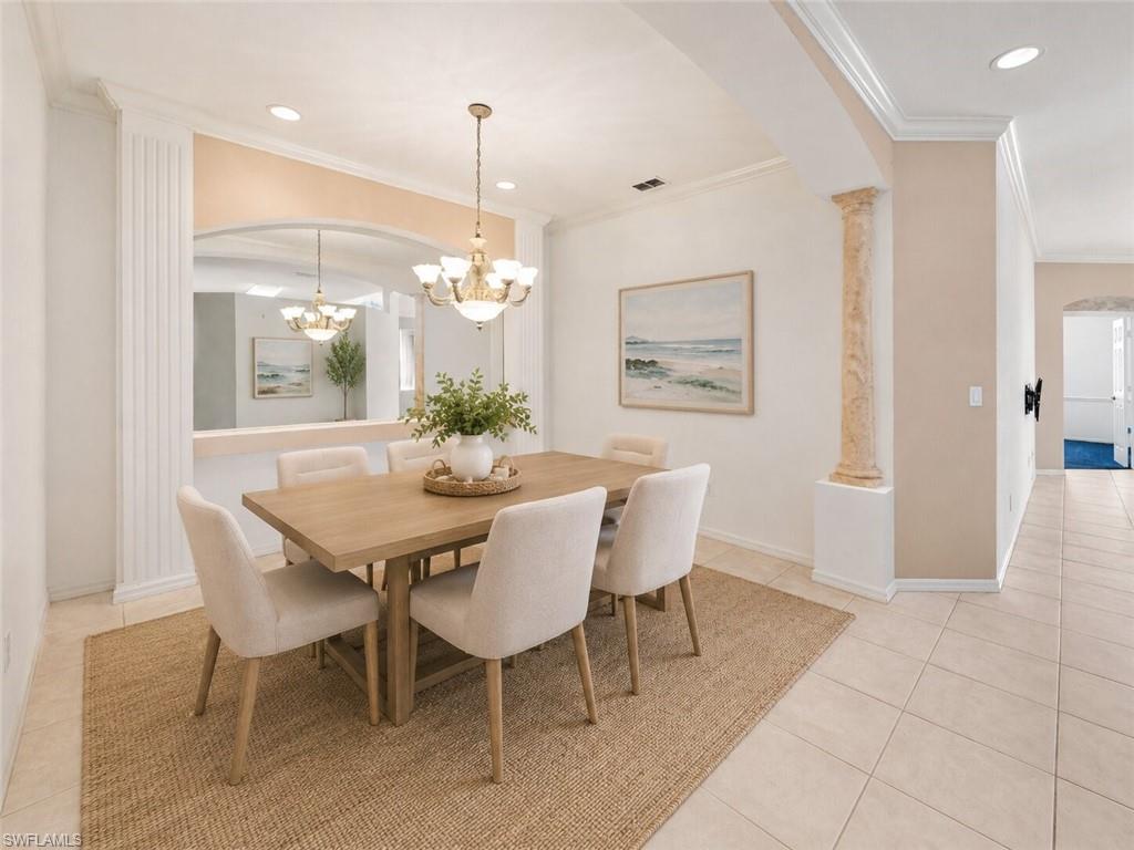 Dining area featuring a wood-finish table with upholstered chairs, set on a natural fiber area rug
