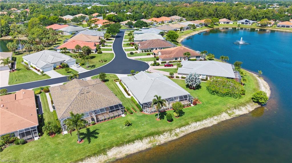 Aerial perspective showcasing a residential community with a large body of water