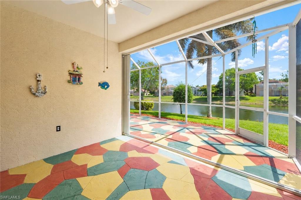 Screened lanai featuring a multicolored geometric pattern on the concrete flooring