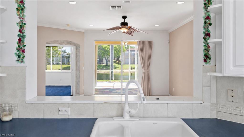Kitchen sink with a white faucet and dual basins
