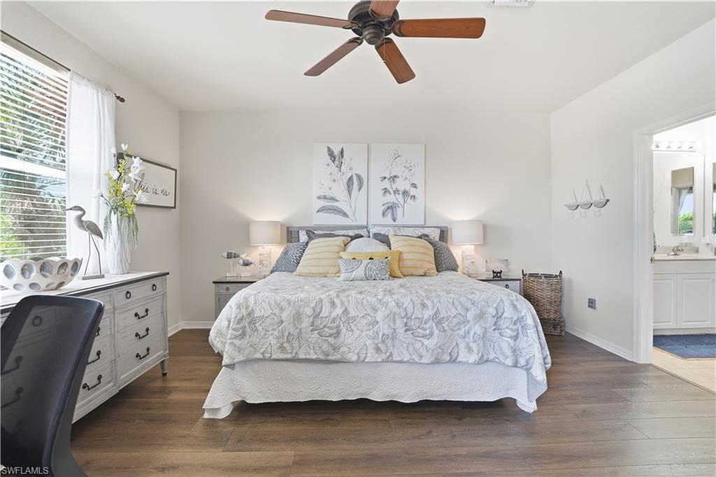 Relax in this spacious primary suite after a day enjoying the Florida sun.