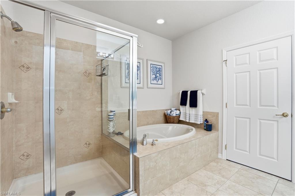 The primary ensuite features a soaking tub and large walk-in shower.