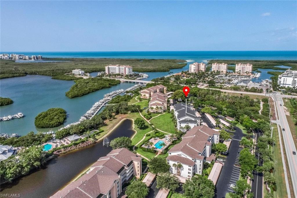 Coastal community featuring waterways and lush landscaping