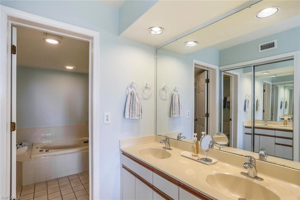 Separate dual vanity with spacious closet