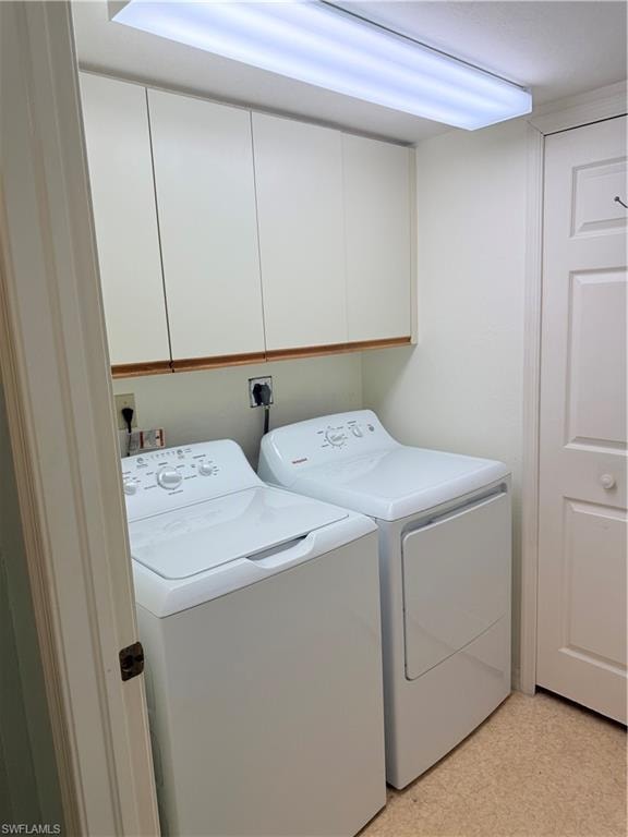 Dedicated laundry area featuring a full-size BRAND NEW washer and dryer, upper cabinetry and full size closet for storage.