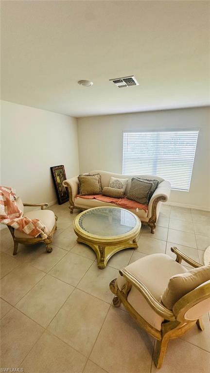 Neutral-toned tile flooring throughout