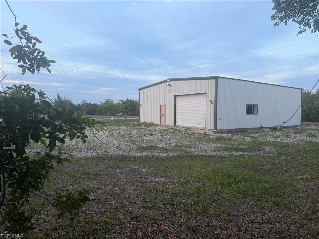 Outbuilding with 5 cleared flat acres with fantastic location.