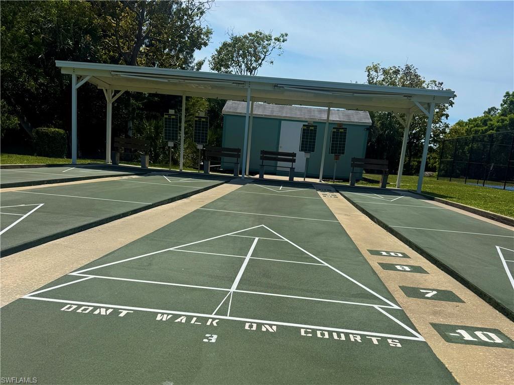 Shuffleboard courts with green playing surfaces and white markings