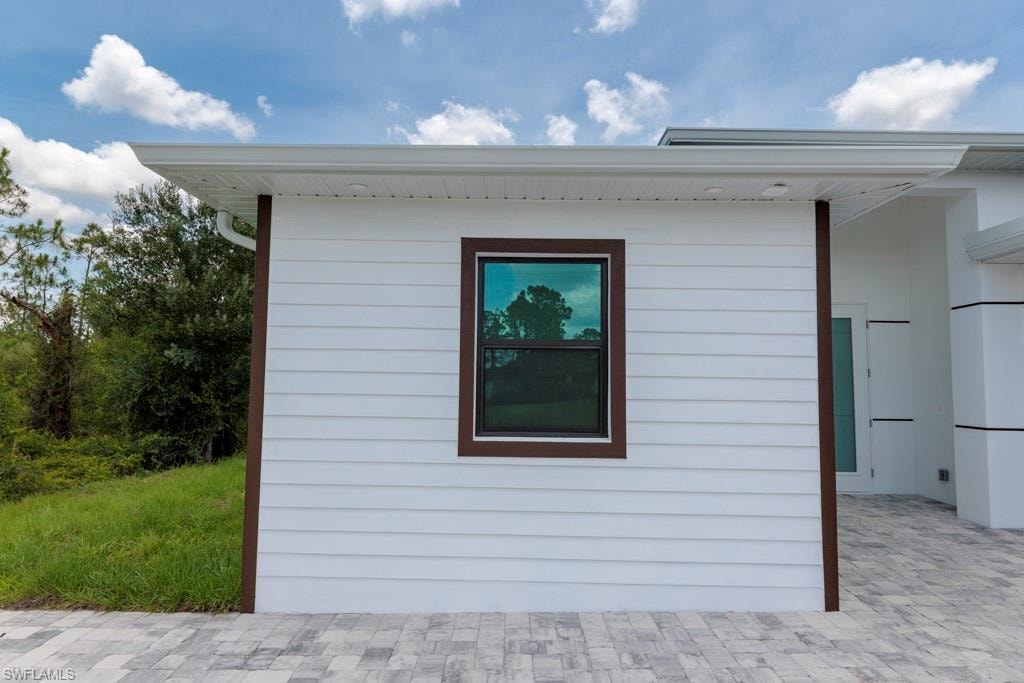 White horizontal siding exterior with contrasting dark trim