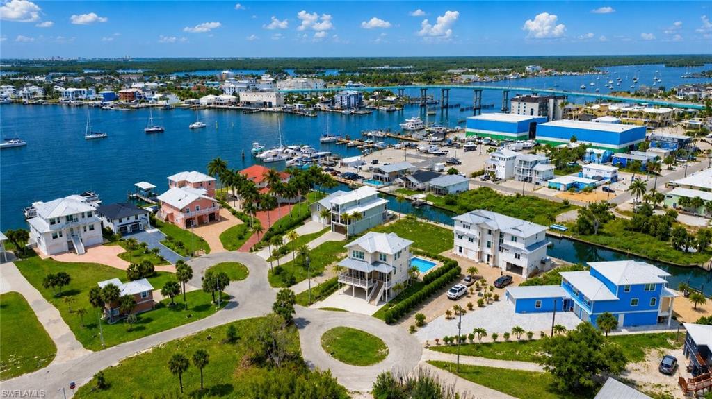 AI Rendering -Waterfront properties with direct canal access, private docks, and a residential cul-de-sac layout - Virtually Edited Image