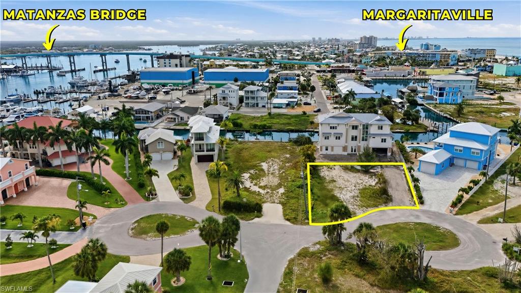 Cleared land lot with canal access, set within a developed residential area - Virtually Edited Image