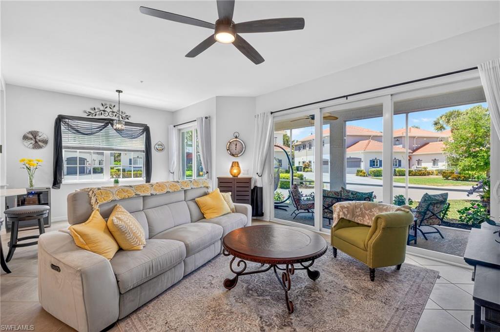 Living area with ceiling fan and tile flooring