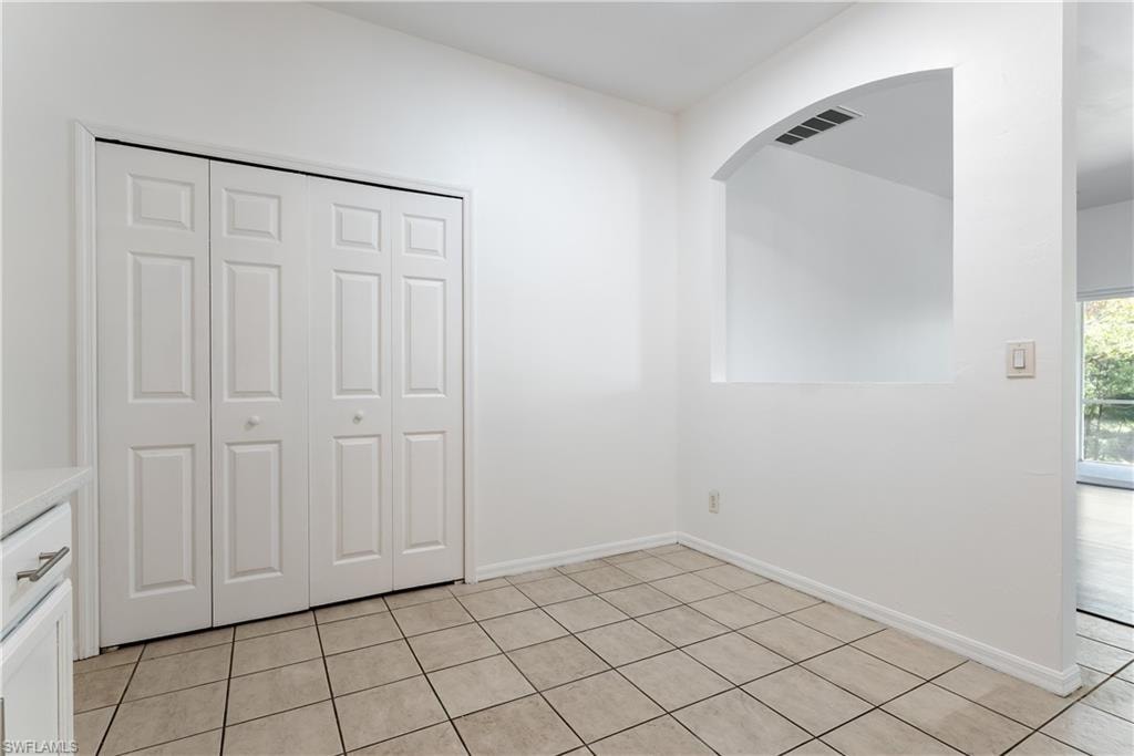 Neutral tile flooring, huge pantry