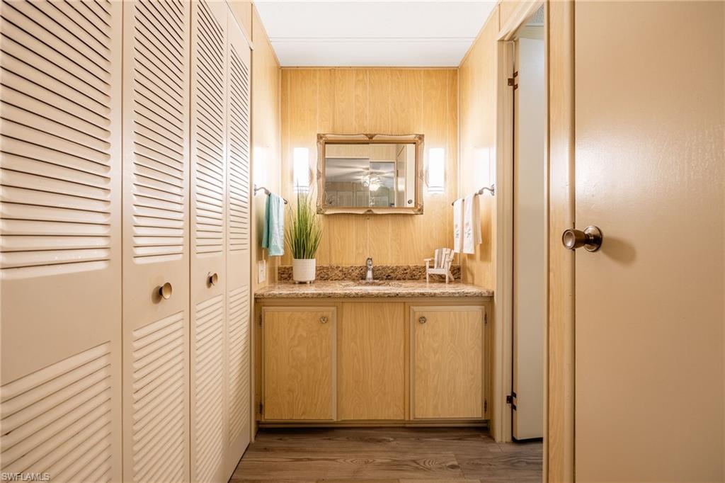 Closet on left and linen closet on right. Sink and prep area are outside the private shower and toilet.