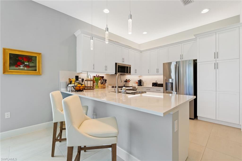 Kitchen features breakfast bar built in pantry