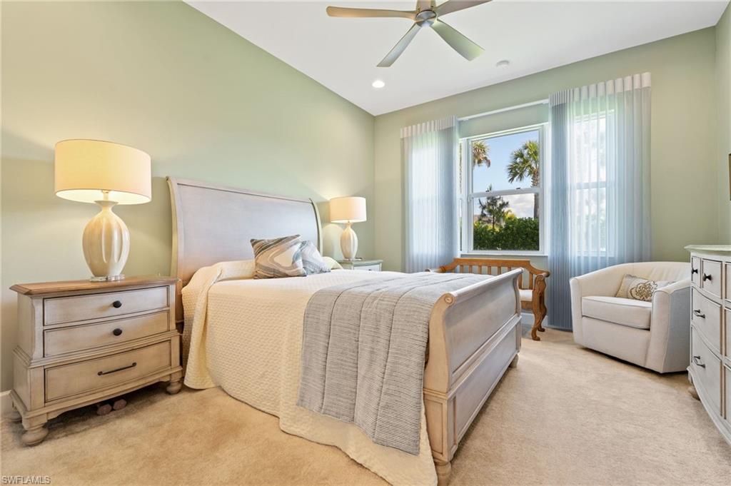 Primary bedroom features custom drapery