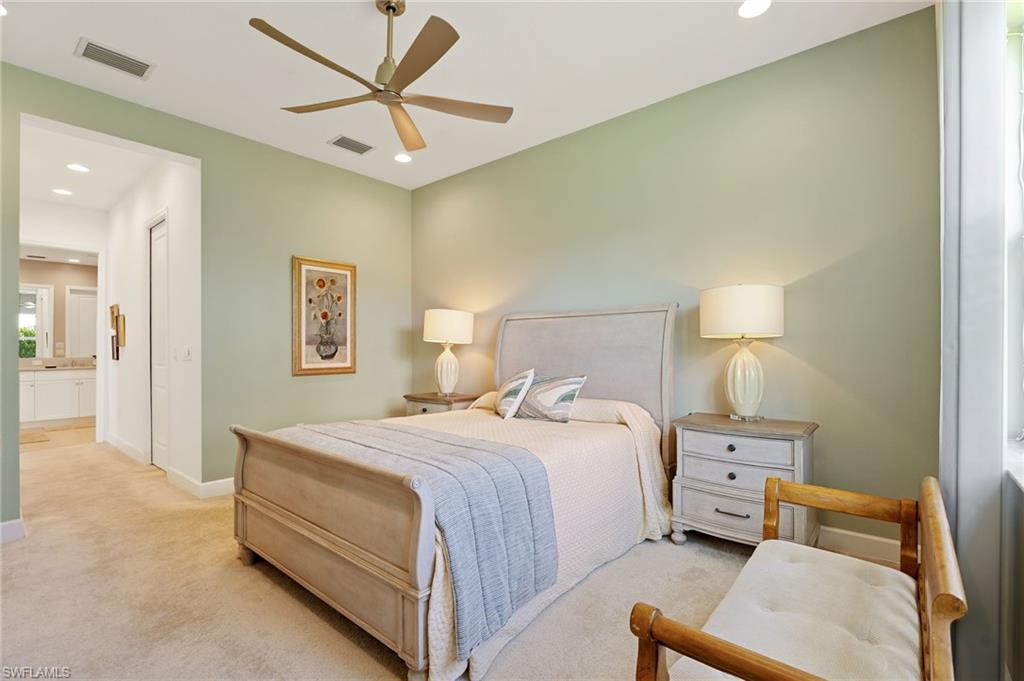 Primary bedroom features designer ceiling fan
