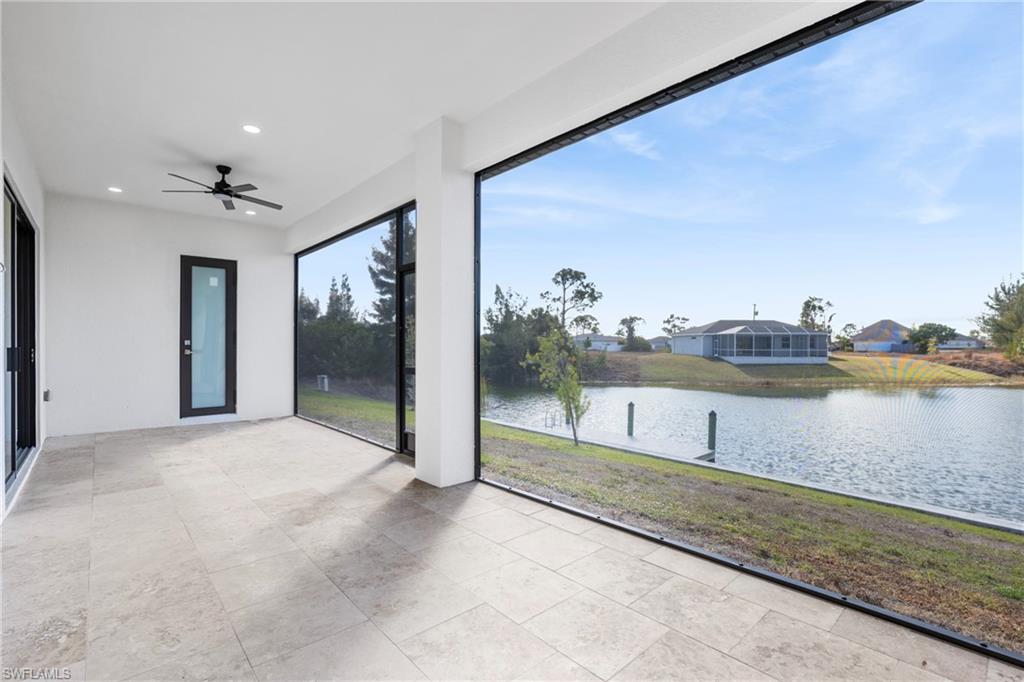 Unfurnished sunroom with a water view