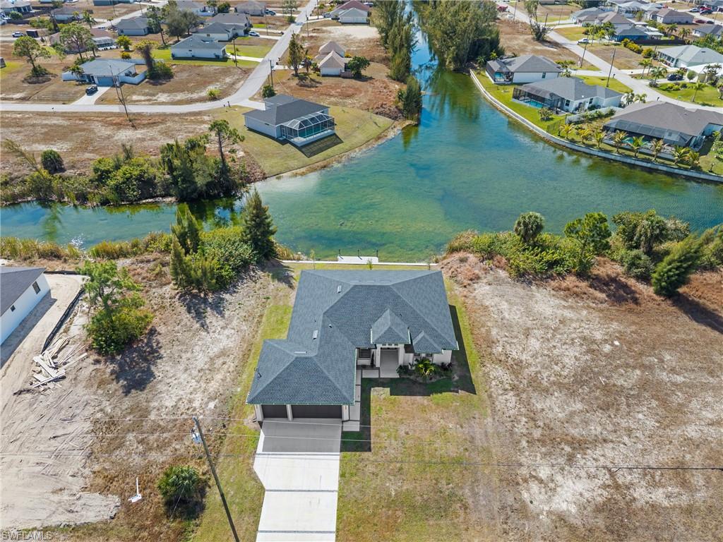Aerial perspective of suburban area featuring a large body of water