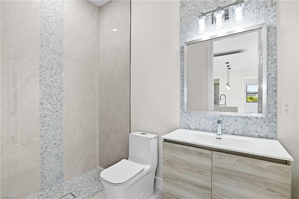 Full bath featuring vanity and a walk in shower