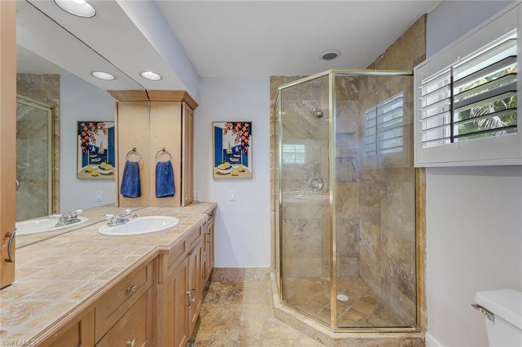Ensuite primary bathroom features a walk-in shower.