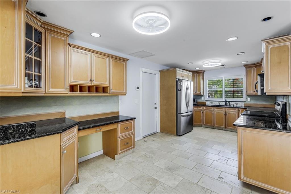 Wood cabinets offer plenty of room for storage.
