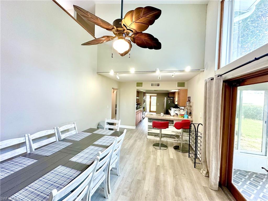Vaulted ceiling with an overhead fan and light fixture