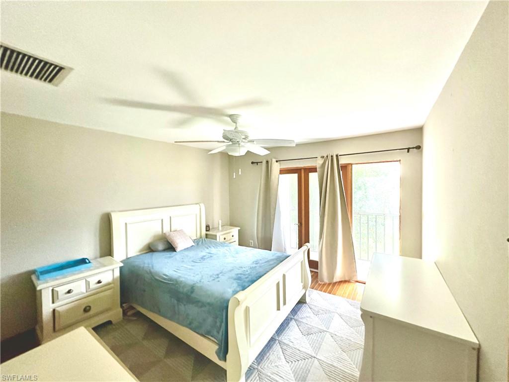 Room featuring wood-finish flooring and a ceiling fan