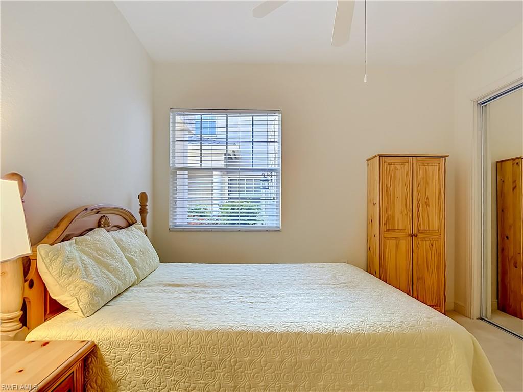 Interior room featuring light-toned walls and carpet flooring
