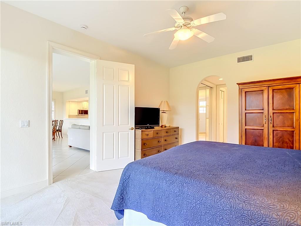 Neutral-toned walls complement a plush carpeted floor