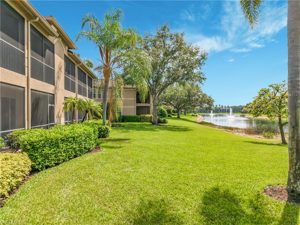 Expansive green lawn with mature landscaping