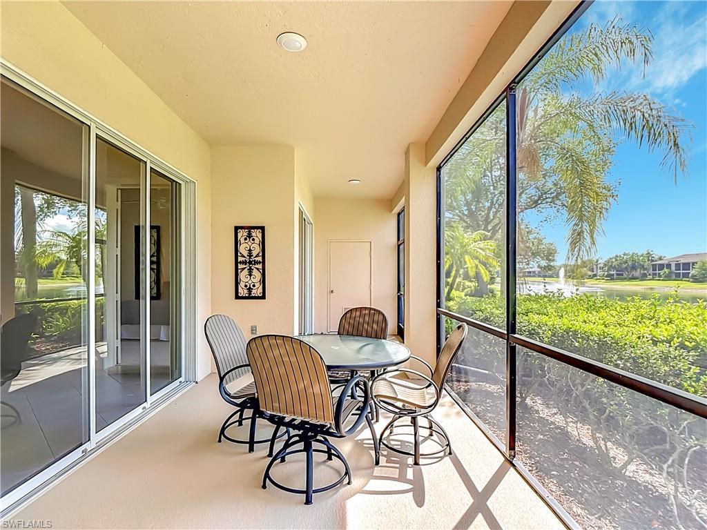 Screened lanai featuring a solid ceiling with recessed lighting, large format tile flooring, and multiple sliding glass doors
