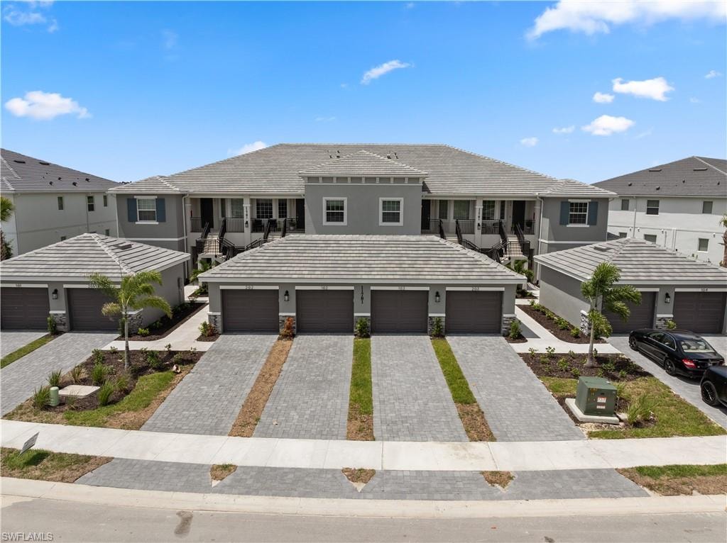 View of property featuring a garage