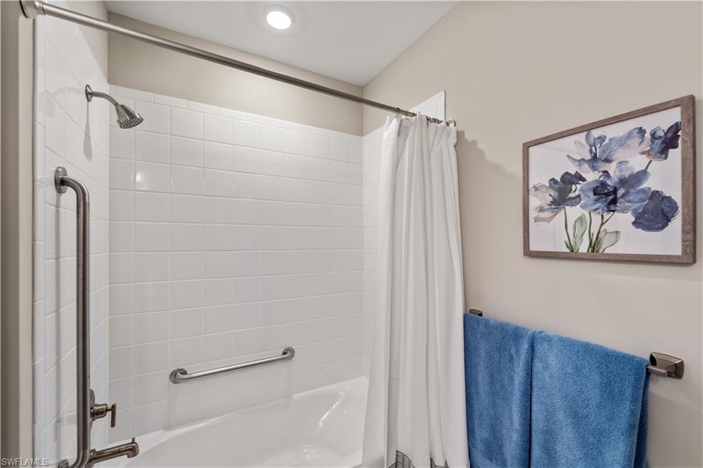 Bathroom with shower / bath combo with shower curtain