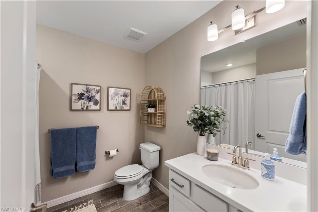 Bathroom with vanity and toilet