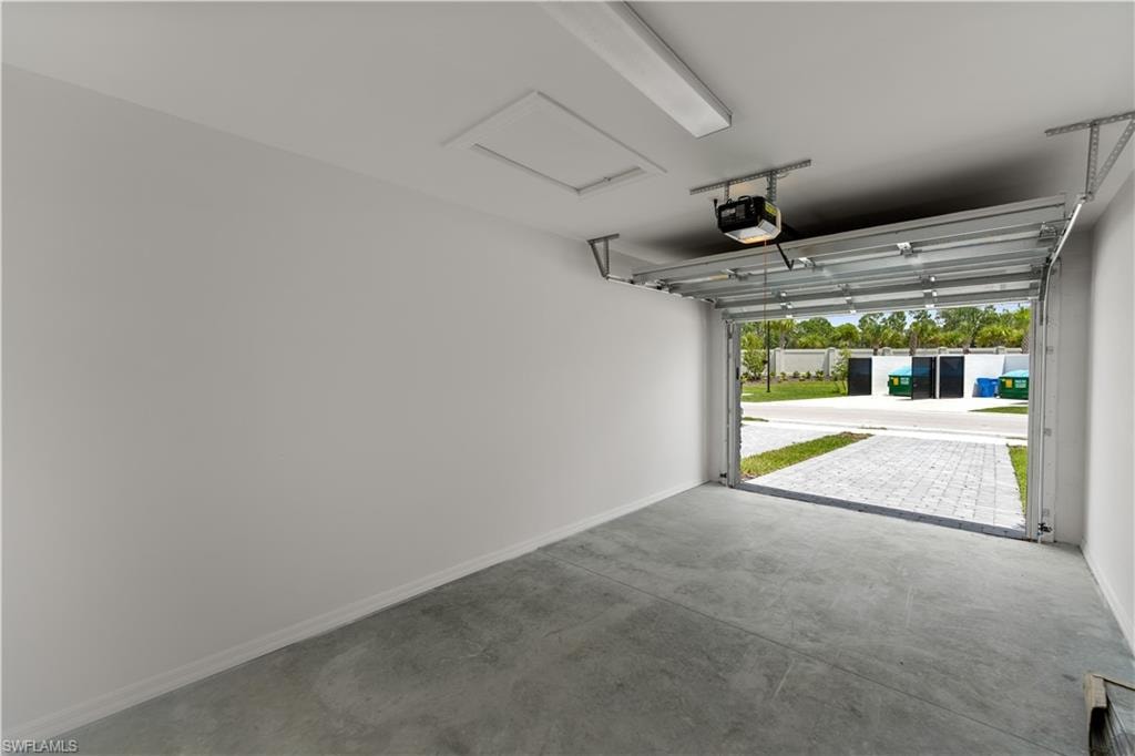 Garage featuring a garage door opener