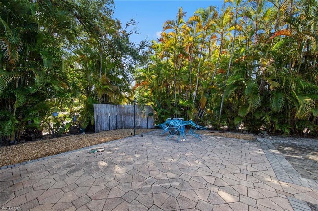 Paved patio area featuring irregular-shaped pavers and a gravel border