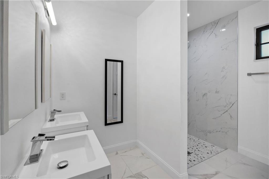 Dual vanity with integrated sinks and chrome faucets